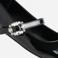 Babies noire vernie boucle strass