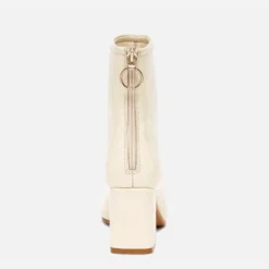 Boots blanc cassé verni à zip arrière