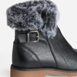 Boots noir cuir bride et tige fourrée