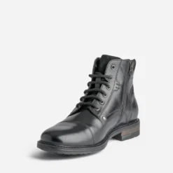 Bottine noire en cuir décor zip et boucle