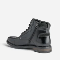 Bottine noire en cuir décor zip et boucle