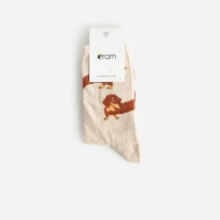Chaussettes beiges motif chiens